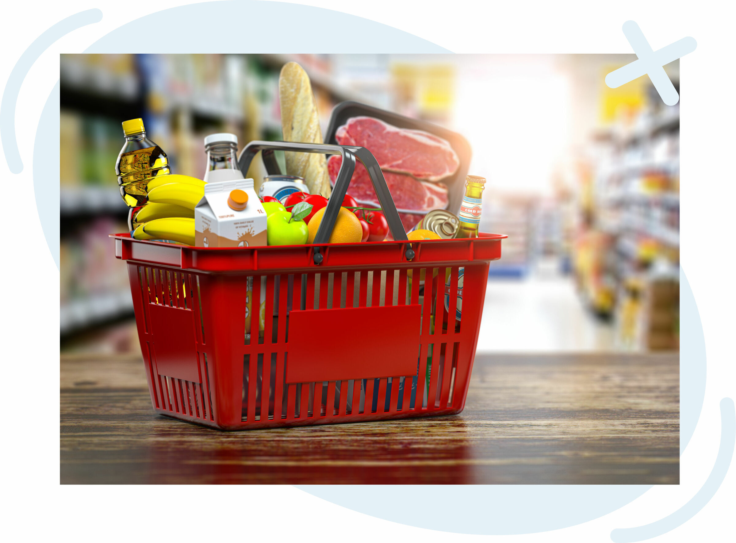 Red shopping basket filled with assorted groceries on a wooden counter in a brightly lit supermarket aisle.
