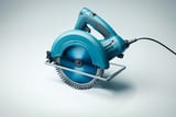 Blue electric circular saw with cord on a light gray background