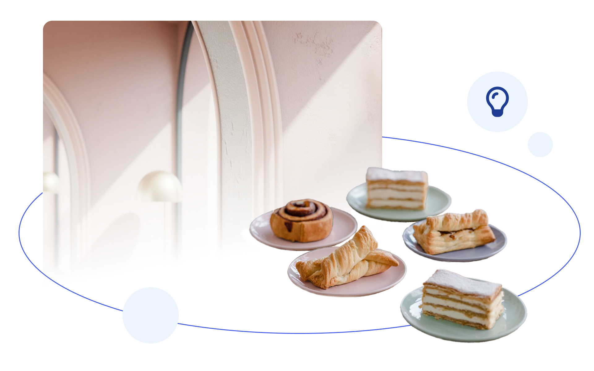 Assorted pastries on pastel plates arranged in front of a softly lit arched interior backdrop.