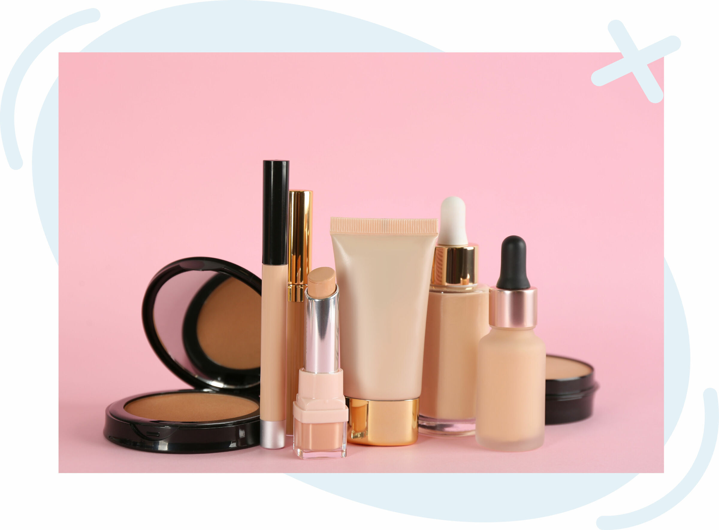 Assorted nude-toned makeup products arranged on a pink background.