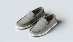 Pair of gray canvas loafers with white rubber soles on a light gray background, angled to show side and top details.