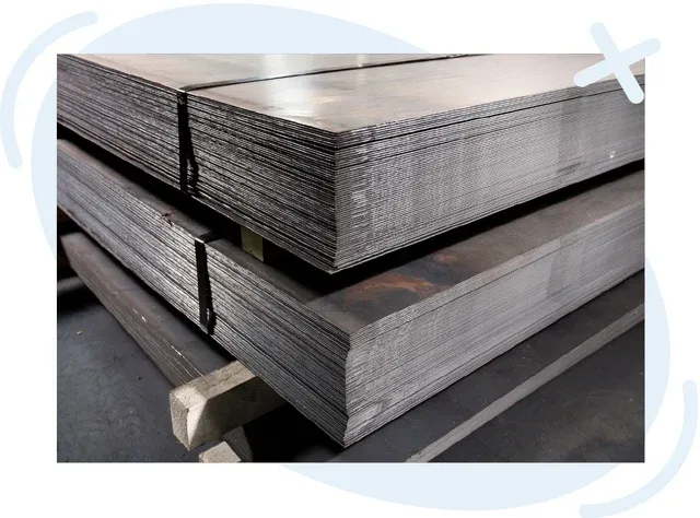 Stacks of large flat metal sheets bound together and resting on supports in an industrial setting.