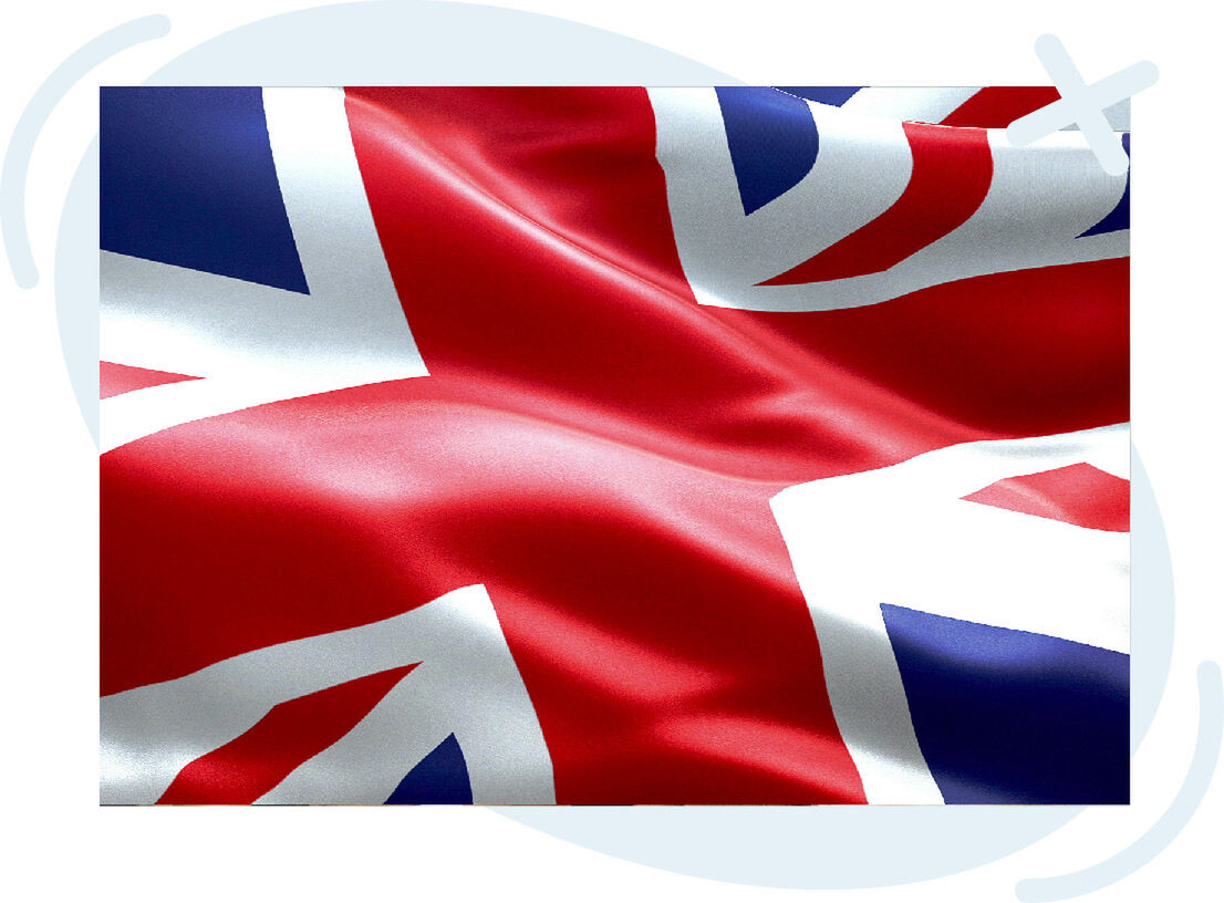 Close-up of a wavy Union Jack flag with bright red, white, and blue colors.