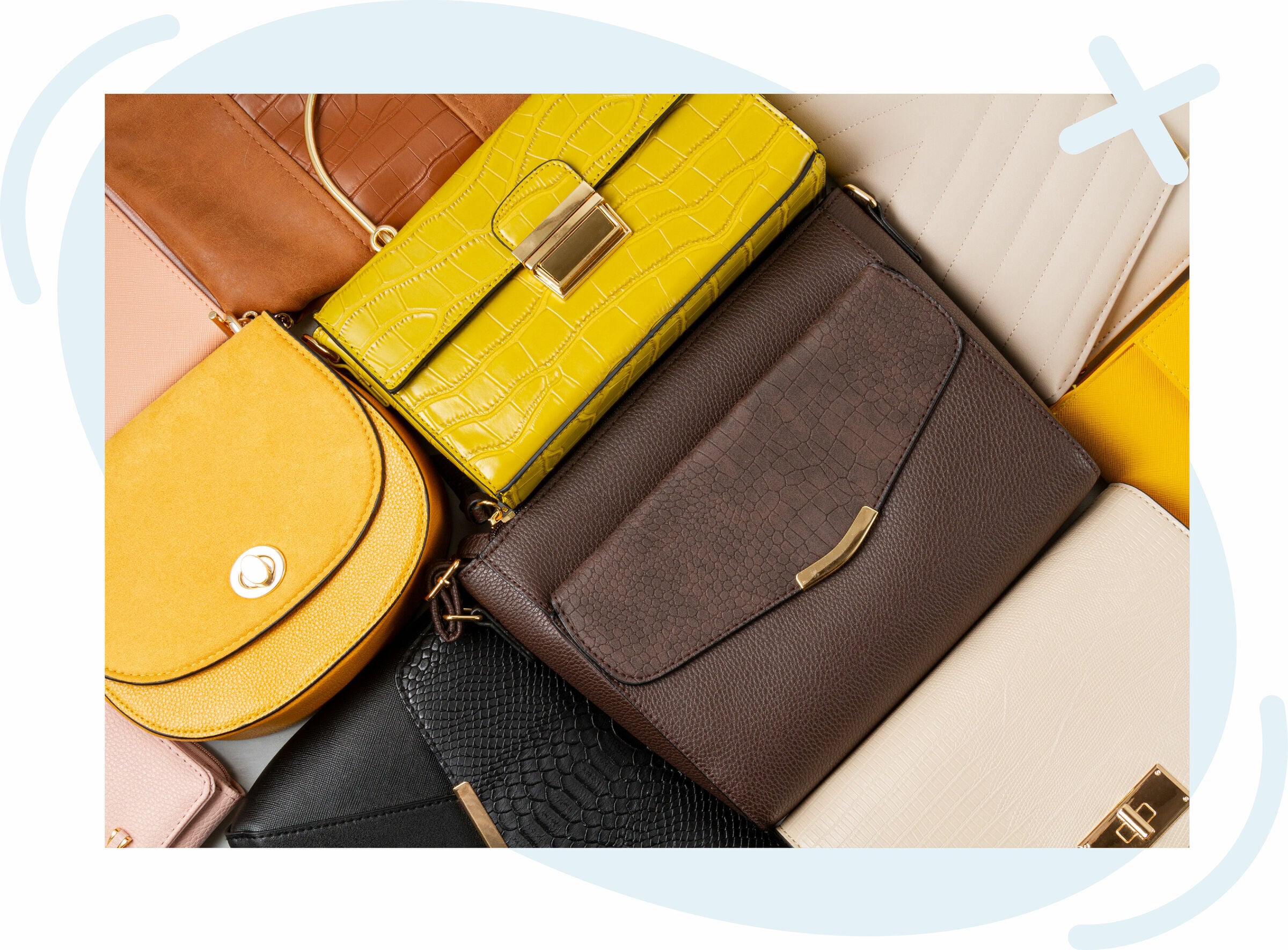 Flat lay of assorted women’s handbags in various colors and textures, including yellow, brown, black, beige, and mustard, arranged in an overlapping pattern with gold hardware details.