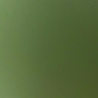 Close-up of a uniformly lit green surface with subtle gradient and faint texture.