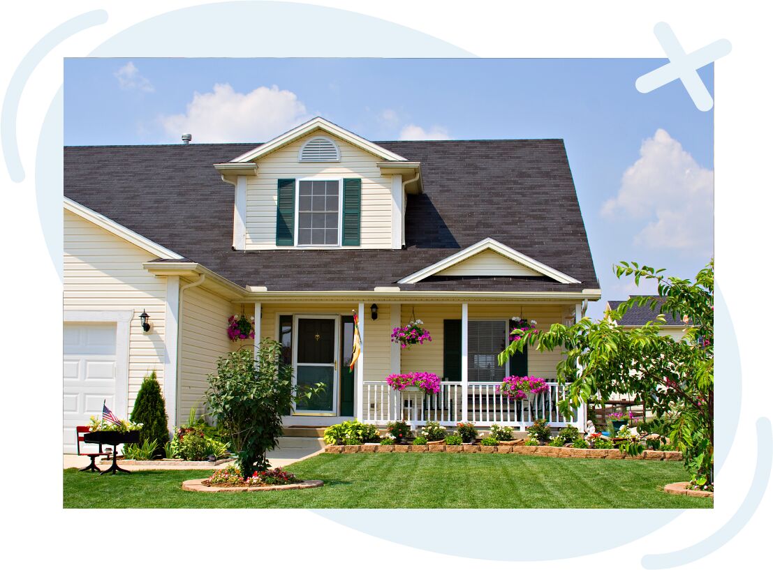 Sunny suburban house with front porch, flowers, and manicured lawn