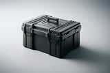 Rugged black hard plastic case with handle and latches on a light gray background.