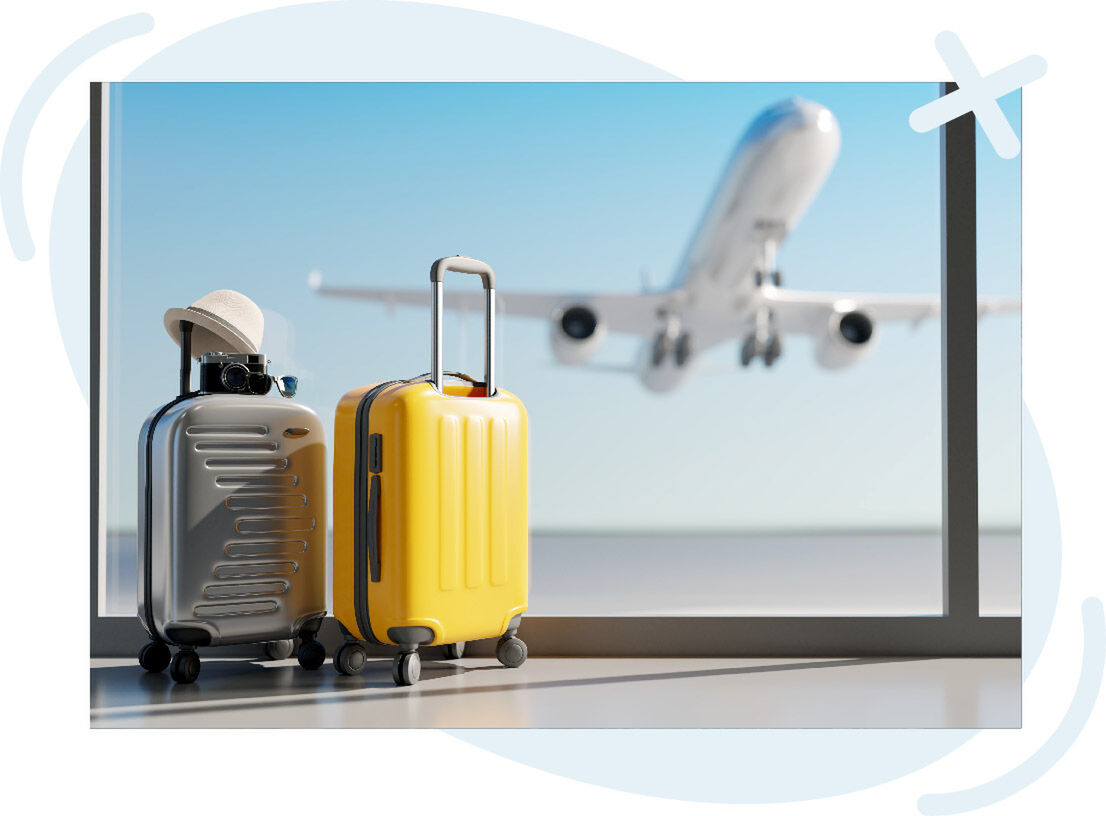 Two suitcases by an airport window with a plane taking off in the background.