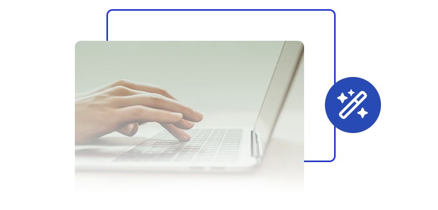 Hands typing on a laptop keyboard with a blue magic wand icon indicating ease or automation.