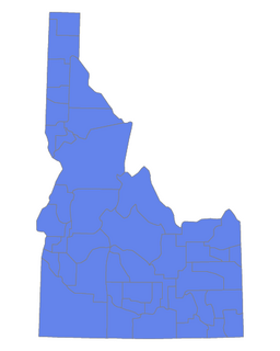 Outline map of Idaho divided into counties, all shaded blue.