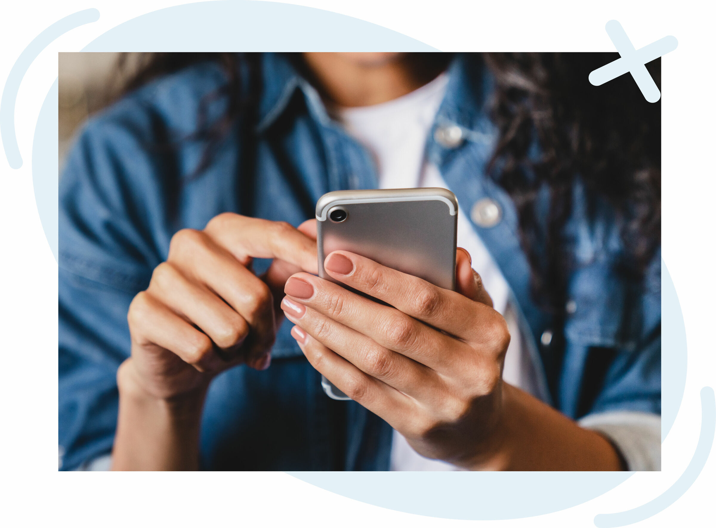Close-up of a person using a smartphone, tapping the screen with one hand while holding the device with the other.