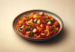 Bowl of colorful chicken and pepper stew with chunks of chicken, red sauce, and mixed bell peppers on a neutral background