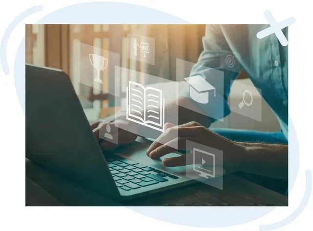 Person using a laptop with floating education icons, symbolizing online learning and courses.