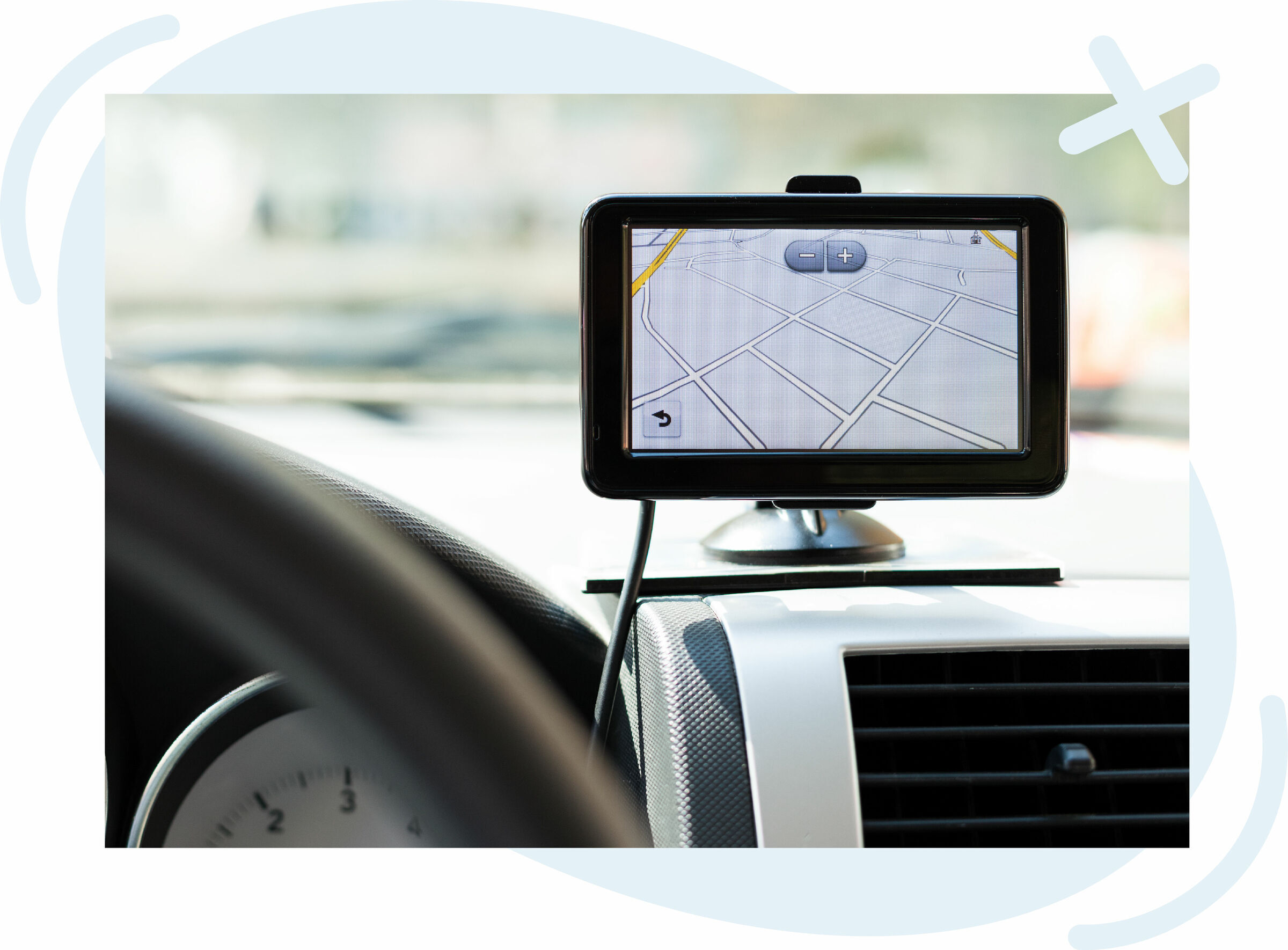 GPS navigation device mounted on a car dashboard showing a street map.