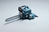 Blue handheld chainsaw with protective hand guard on a light gray background.