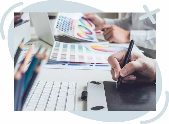 Designer’s workspace with color swatches and a graphics tablet